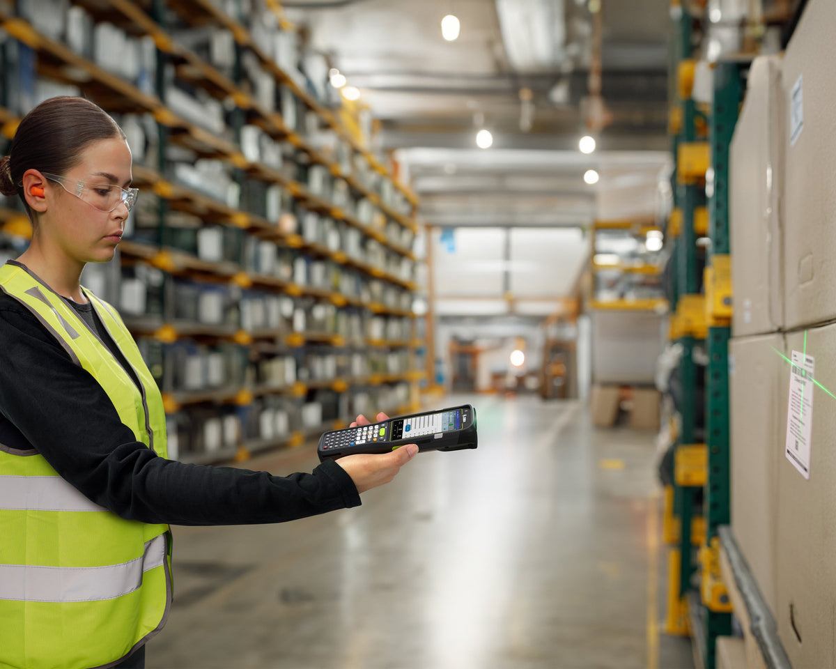 Zebra MC3450 rugged 5G keypad mobile computer, straight shooter, 38-key function numeric keypad (MC345B-3S1M53SS-A6) – in use in a warehouse
