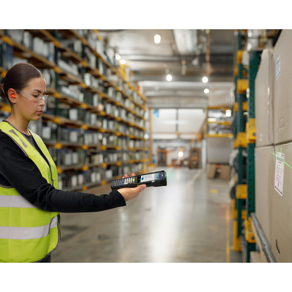 Zebra MC3400 rugged keypad mobile computer, straight shooter, 38-key function numeric keypad (MC3401-0S1R63SS-A6) – in use in a warehouse
